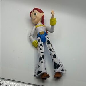 Disney Jessie Cowgirl Doll – Red Hair, White & Black Outfit, Yellow Accents